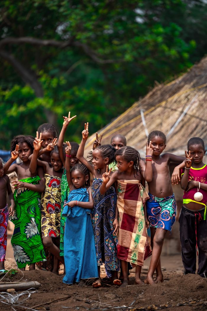 about-01 A lively group of children in colorful attire enjoying their day in rural Abuja, Nigeria.